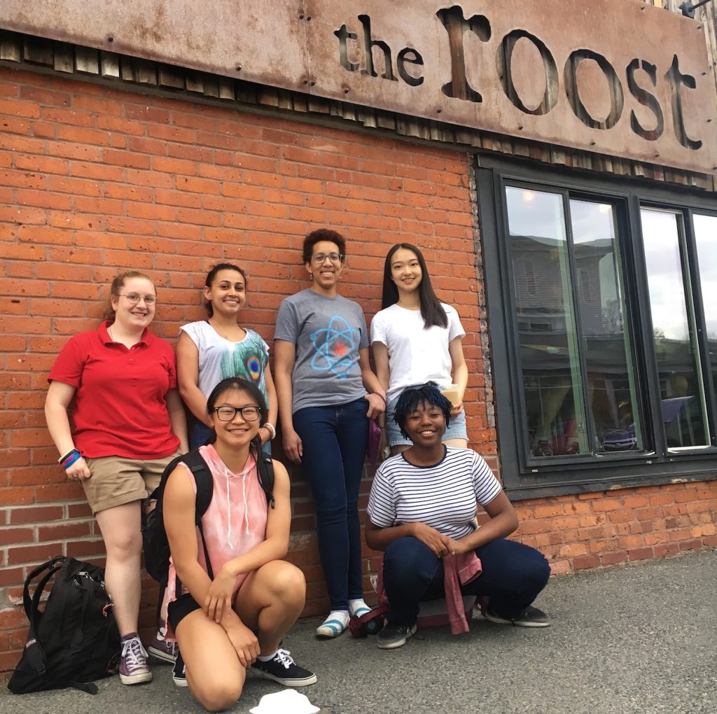 Photograph of students in the microsmithy lab, outside of a coffee shop.