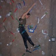 Lean back and get ready to step up on that big green hold with the foot closest to the wall (the inside foot)